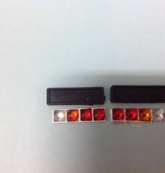 Square tail lights surrounds + lenses - 2 red 1 orange & 1 clear - Comes as a pair